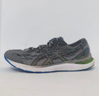 pair of grey ASICS Gel-Kayano running shoes featuring a patterned upper and a blue and white outsole.