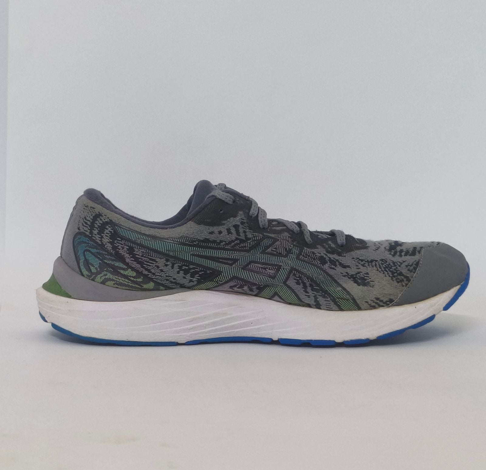 pair of grey ASICS Gel-Kayano running shoes featuring a patterned upper and a blue and white outsole.
