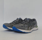 pair of grey ASICS Gel-Kayano running shoes featuring a patterned upper and a blue and white outsole.