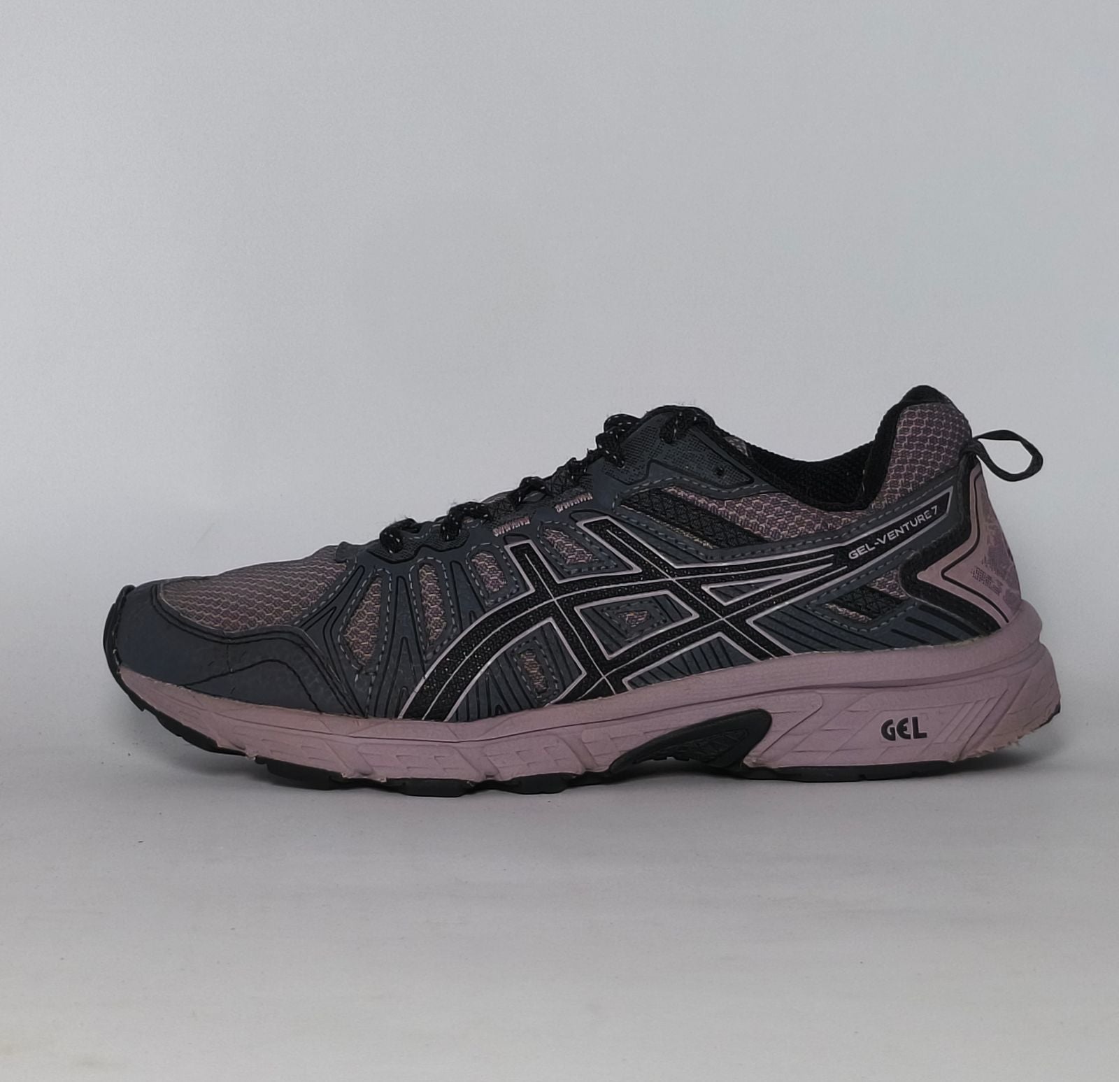 charcoal and lavender Asics GEL-Venture 7 trail running shoe featuring a rugged outsole and signature Asics stripes.