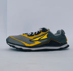 Grey and yellow athletic sneakers with breathable mesh upper and cushioned sole for running and casual wear