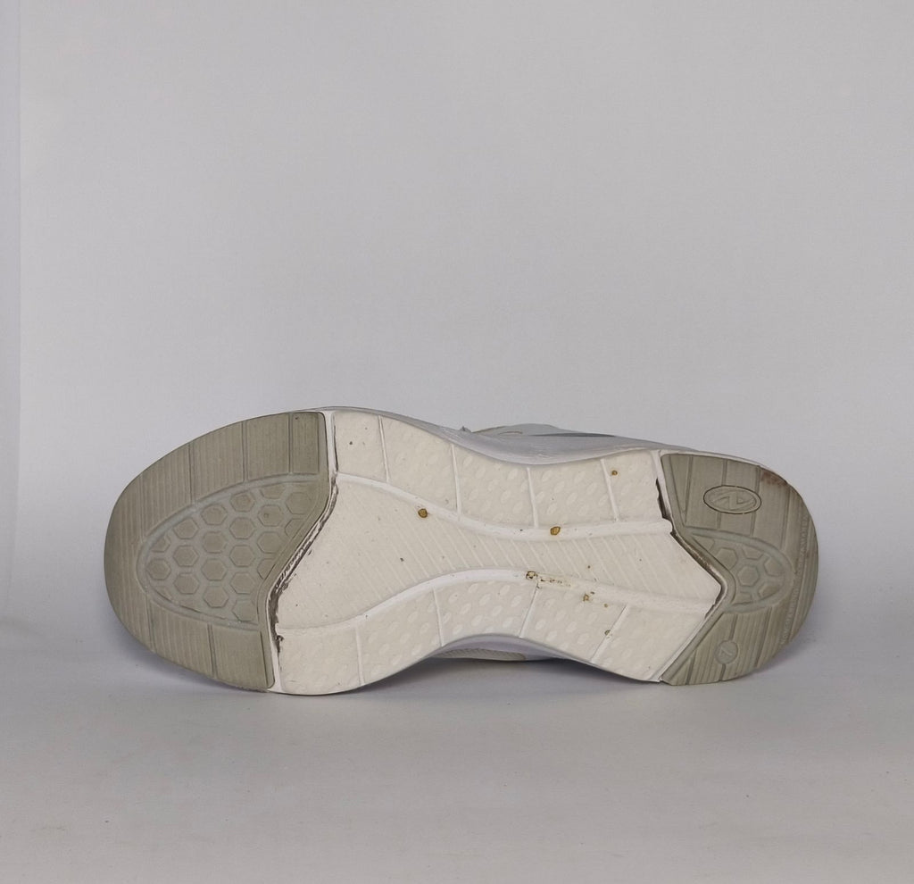 white and light grey athletic running shoe featuring silver accents and a thick white cushioned midsole.