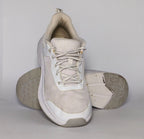 white and light grey athletic running shoe featuring silver accents and a thick white cushioned midsole.