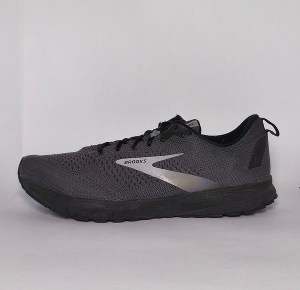 charcoal grey Brooks Revel running shoe featuring a silver logo and a black cushioned midsole.