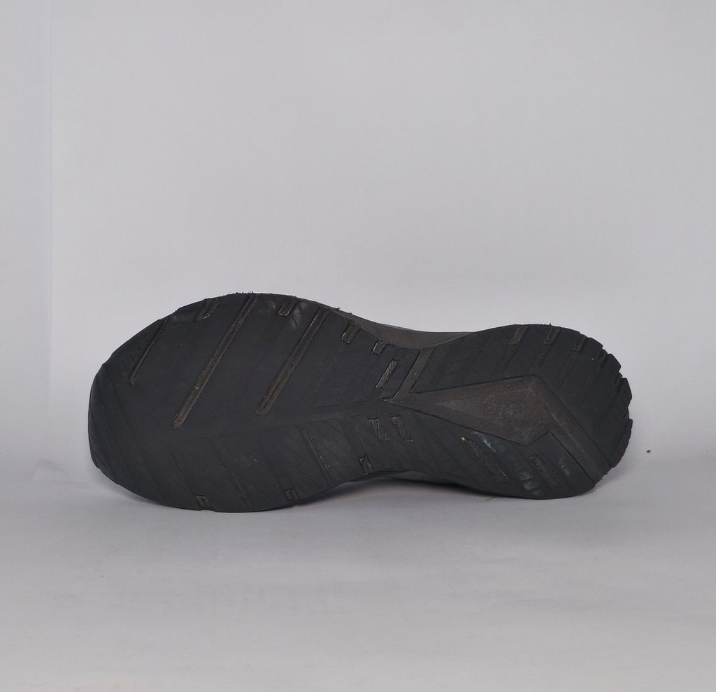 charcoal grey Brooks Revel running shoe featuring a silver logo and a black cushioned midsole.