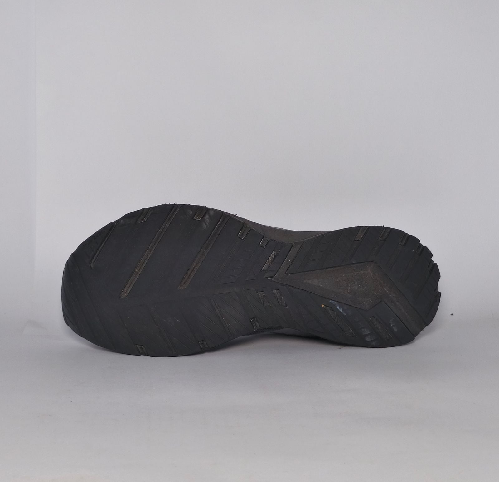 charcoal grey Brooks Revel running shoe featuring a silver logo and a black cushioned midsole.