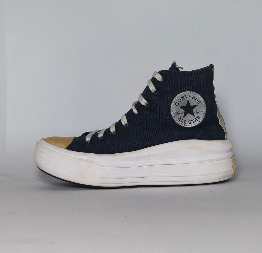navy blue Converse Move platform high-top sneaker featuring a thick white midsole and a gold toe cap.