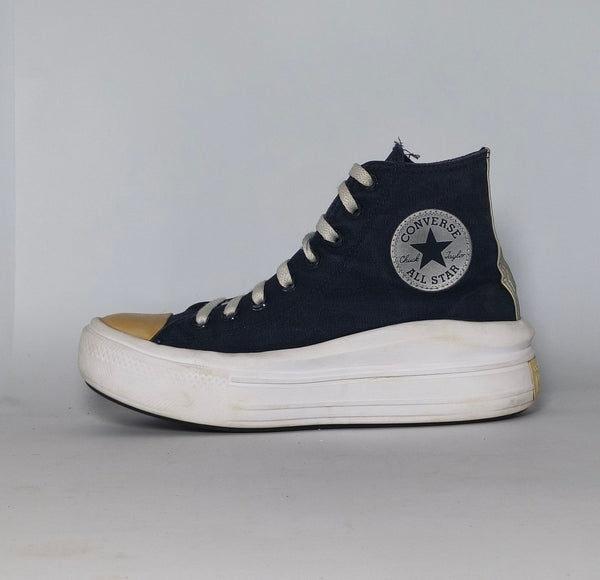 navy blue Converse Move platform high-top sneaker featuring a thick white midsole and a gold toe cap.