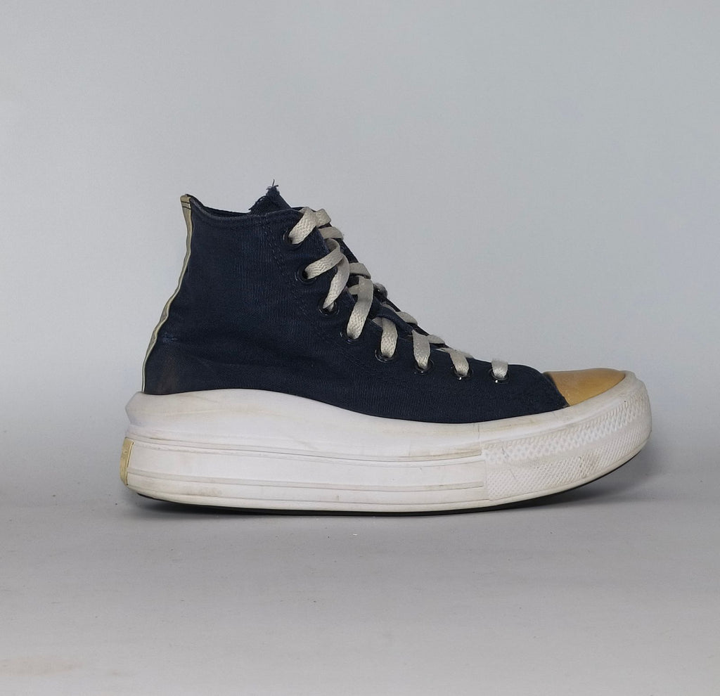 navy blue Converse Move platform high-top sneaker featuring a thick white midsole and a gold toe cap.