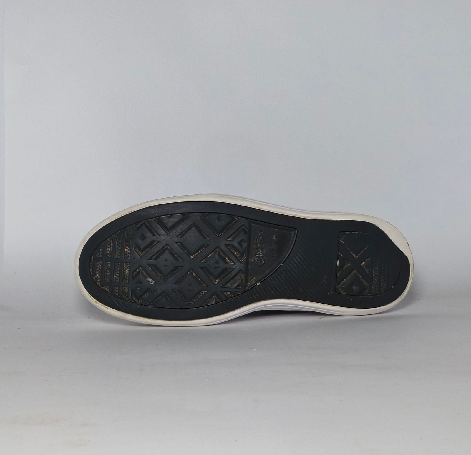 navy blue Converse Move platform high-top sneaker featuring a thick white midsole and a gold toe cap.