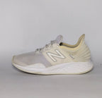 cream and light grey New Balance Fresh Foam Roav running shoe featuring a white textured midsole and a modern Ultra Heel design.