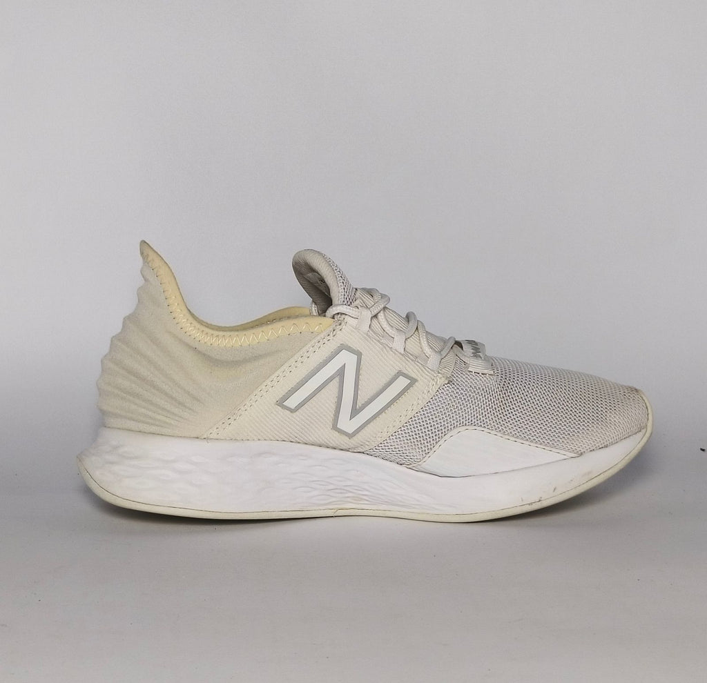 cream and light grey New Balance Fresh Foam Roav running shoe featuring a white textured midsole and a modern Ultra Heel design.