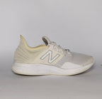 cream and light grey New Balance Fresh Foam Roav running shoe featuring a white textured midsole and a modern Ultra Heel design.