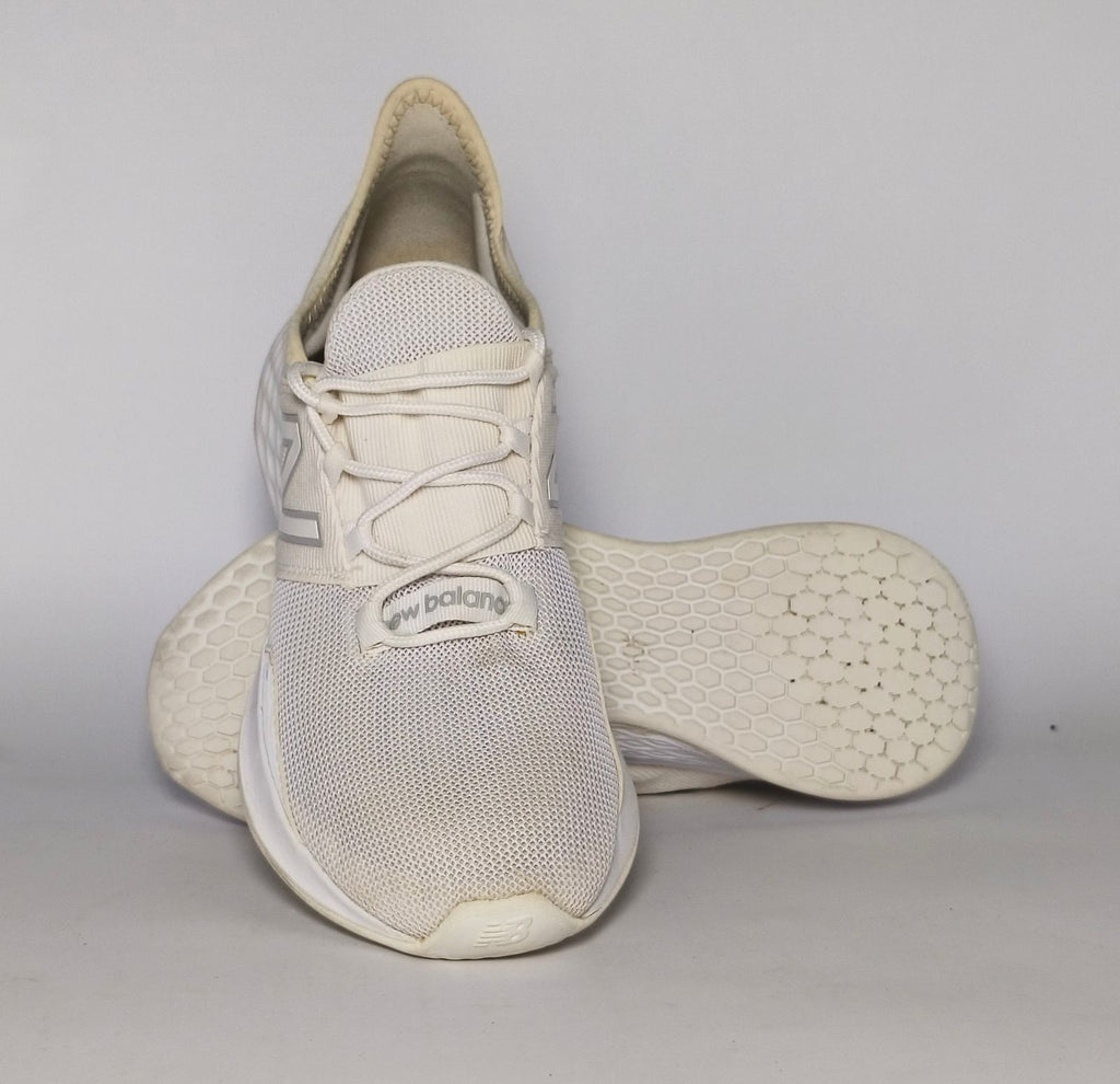 cream and light grey New Balance Fresh Foam Roav running shoe featuring a white textured midsole and a modern Ultra Heel design.