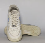 white Nike Air Force 1 Low sneaker featuring a light blue patterned Swoosh and a vintage sail-colored midsole.