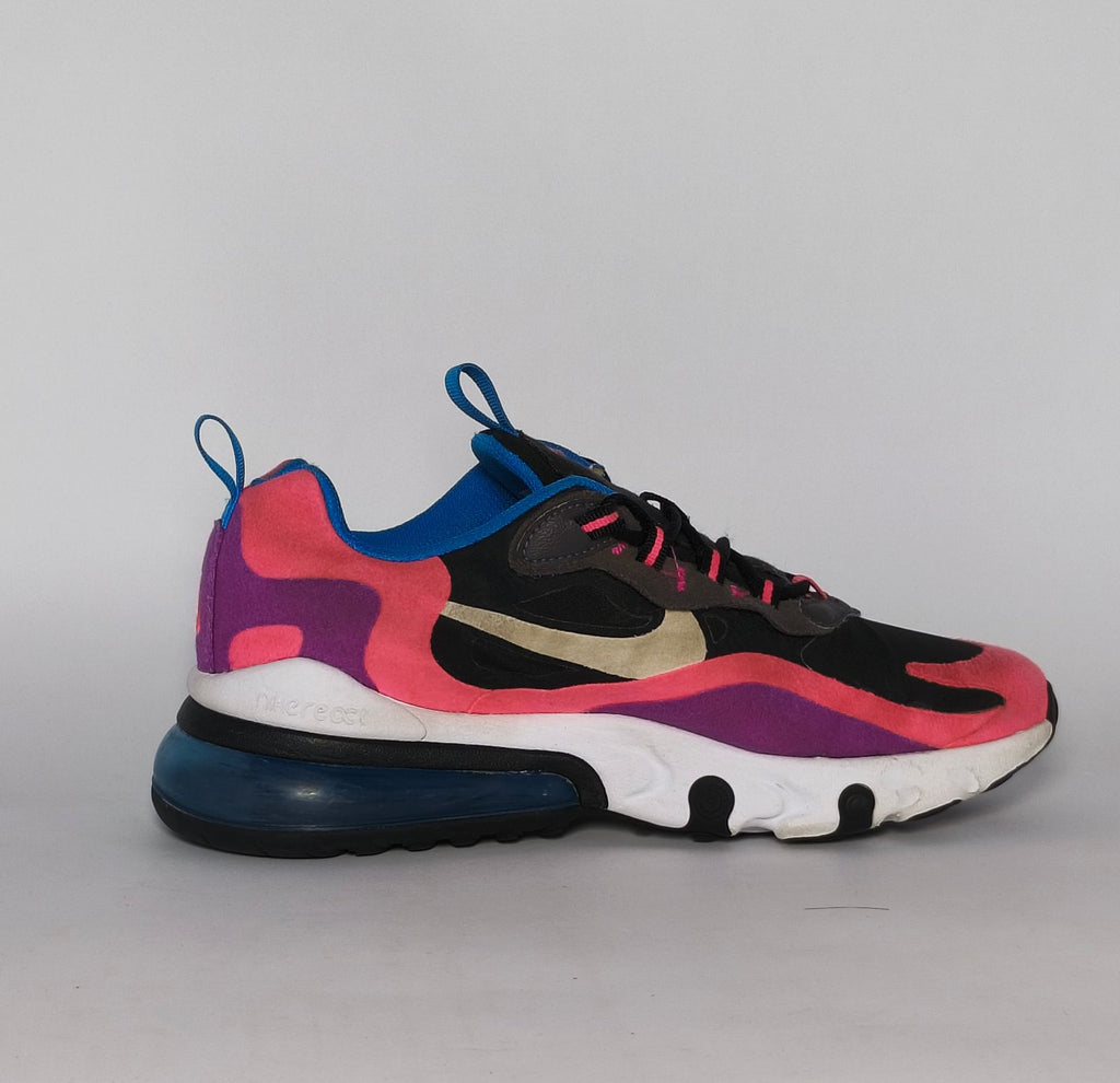 Nike Air Max 270 React sneaker featuring a pink and purple upper, a white React midsole, and a blue tinted Max Air heel unit.