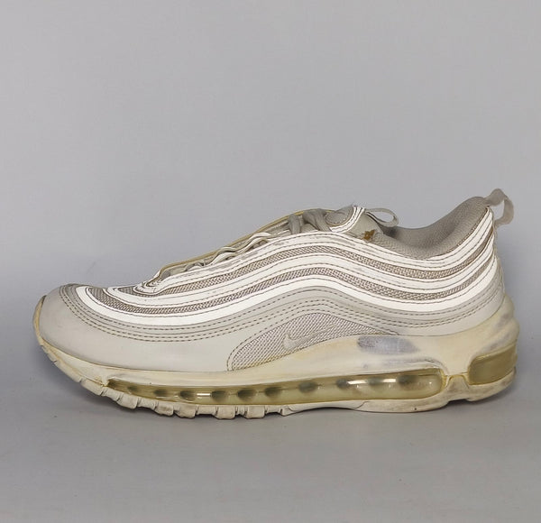 light grey and cream Nike Air Max 97 sneaker featuring the iconic ripple design and a full-length visible Max Air cushioning unit.