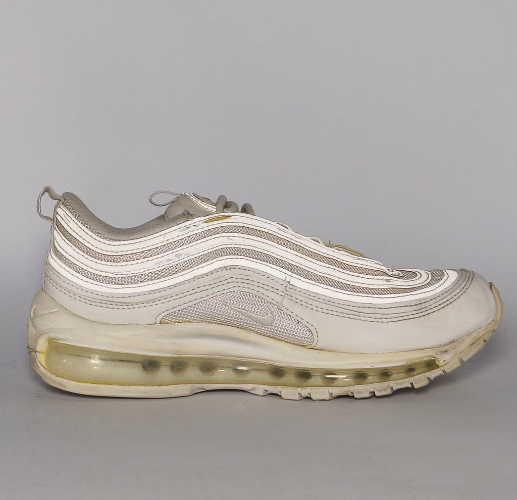 light grey and cream Nike Air Max 97 sneaker featuring the iconic ripple design and a full-length visible Max Air cushioning unit.