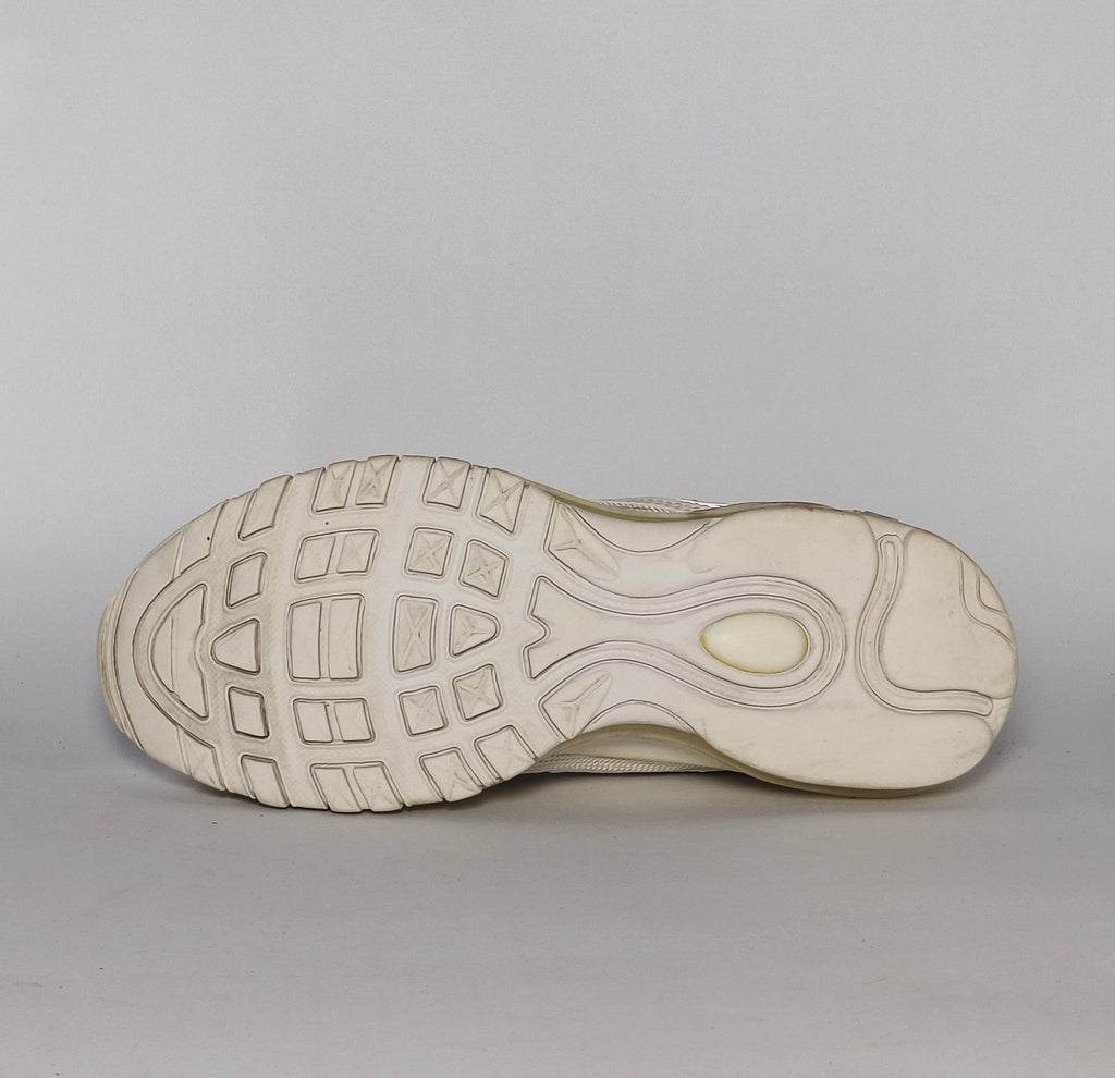 light grey and cream Nike Air Max 97 sneaker featuring the iconic ripple design and a full-length visible Max Air cushioning unit.