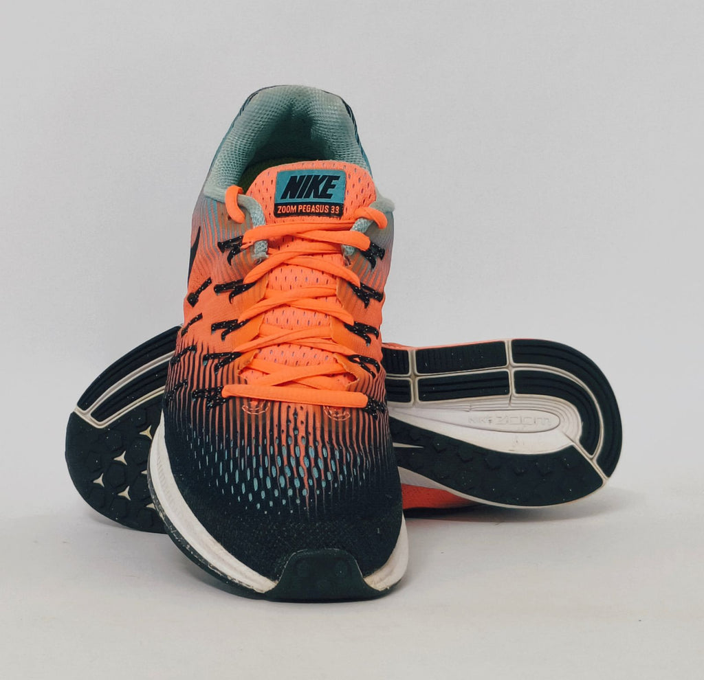 Nike Air Zoom Pegasus 33 running shoe featuring an orange and blue gradient mesh upper and a white Nike Zoom midsole.