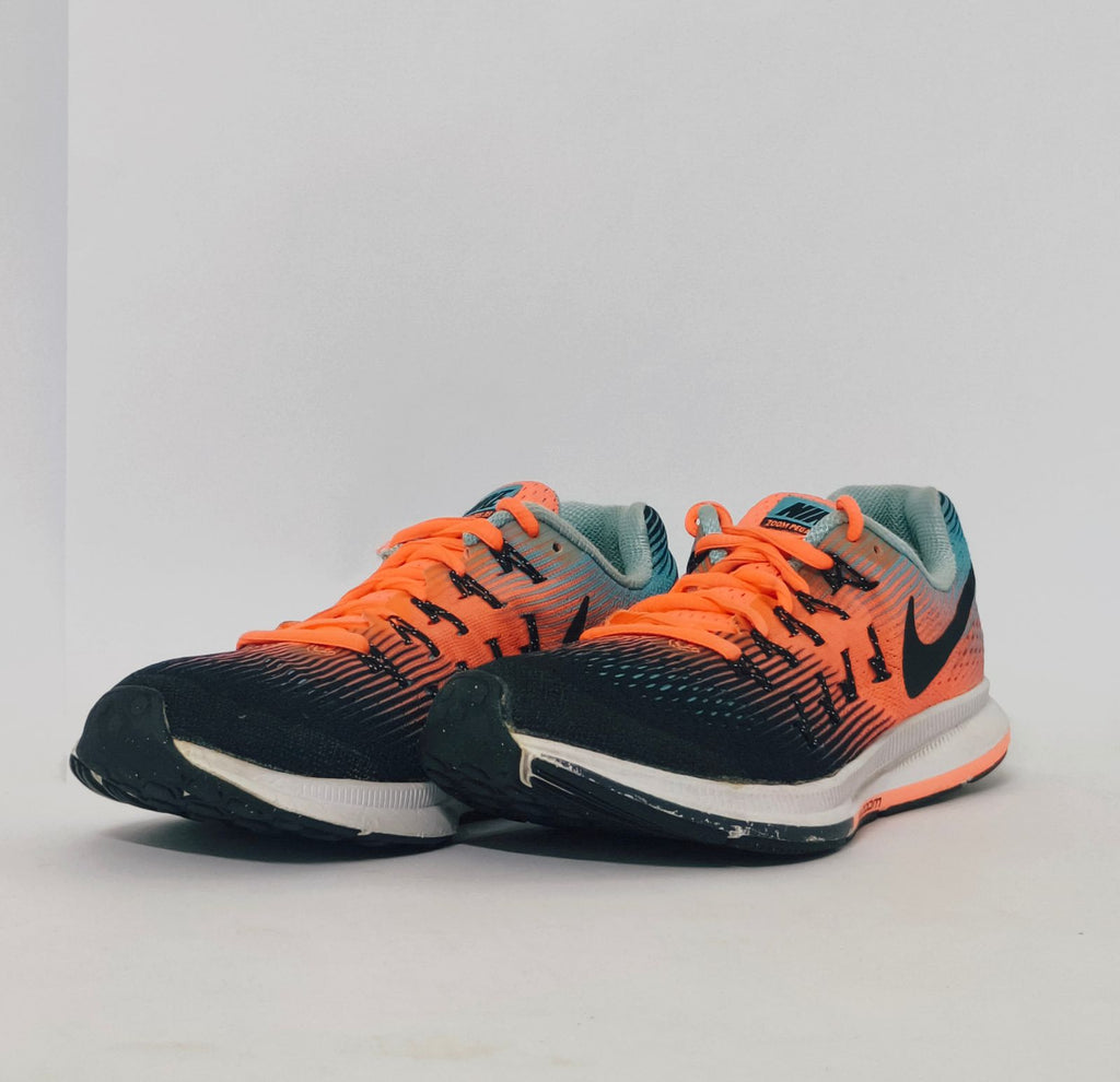 Nike Air Zoom Pegasus 33 running shoe featuring an orange and blue gradient mesh upper and a white Nike Zoom midsole.