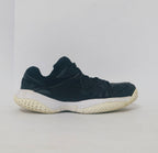 black Nike court sneaker featuring a white Swoosh and a thick white midsole with court-ready traction.