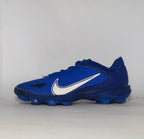 royal blue Nike Alpha Huarache baseball cleat featuring a white Swoosh and a specialized molded cleat outsole for field traction.