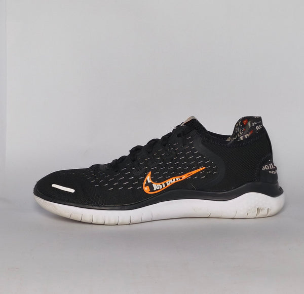 Nike Free RN 2018 running shoe featuring an orange "Just Do It" Swoosh and a white flexible midsole.