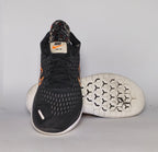 Nike Free RN 2018 running shoe featuring an orange "Just Do It" Swoosh and a white flexible midsole.