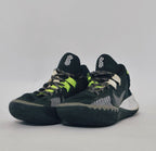 Nike Kyrie Flytrap basketball shoe featuring lime green accents, a white midsole, and a high-traction black outsole.
