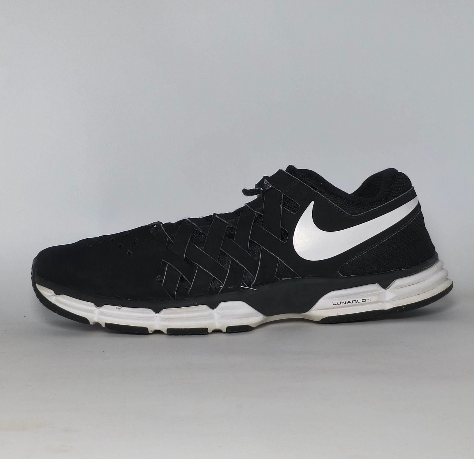 black Nike Lunar Fingertrap TR training shoe featuring a white Swoosh and a white Lunarlon midsole.