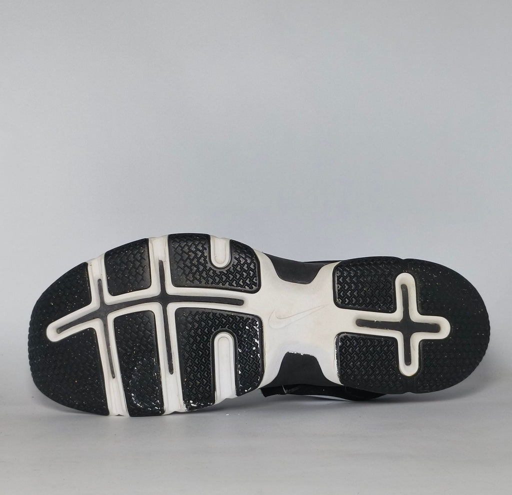 black Nike Lunar Fingertrap TR training shoe featuring a white Swoosh and a white Lunarlon midsole.
