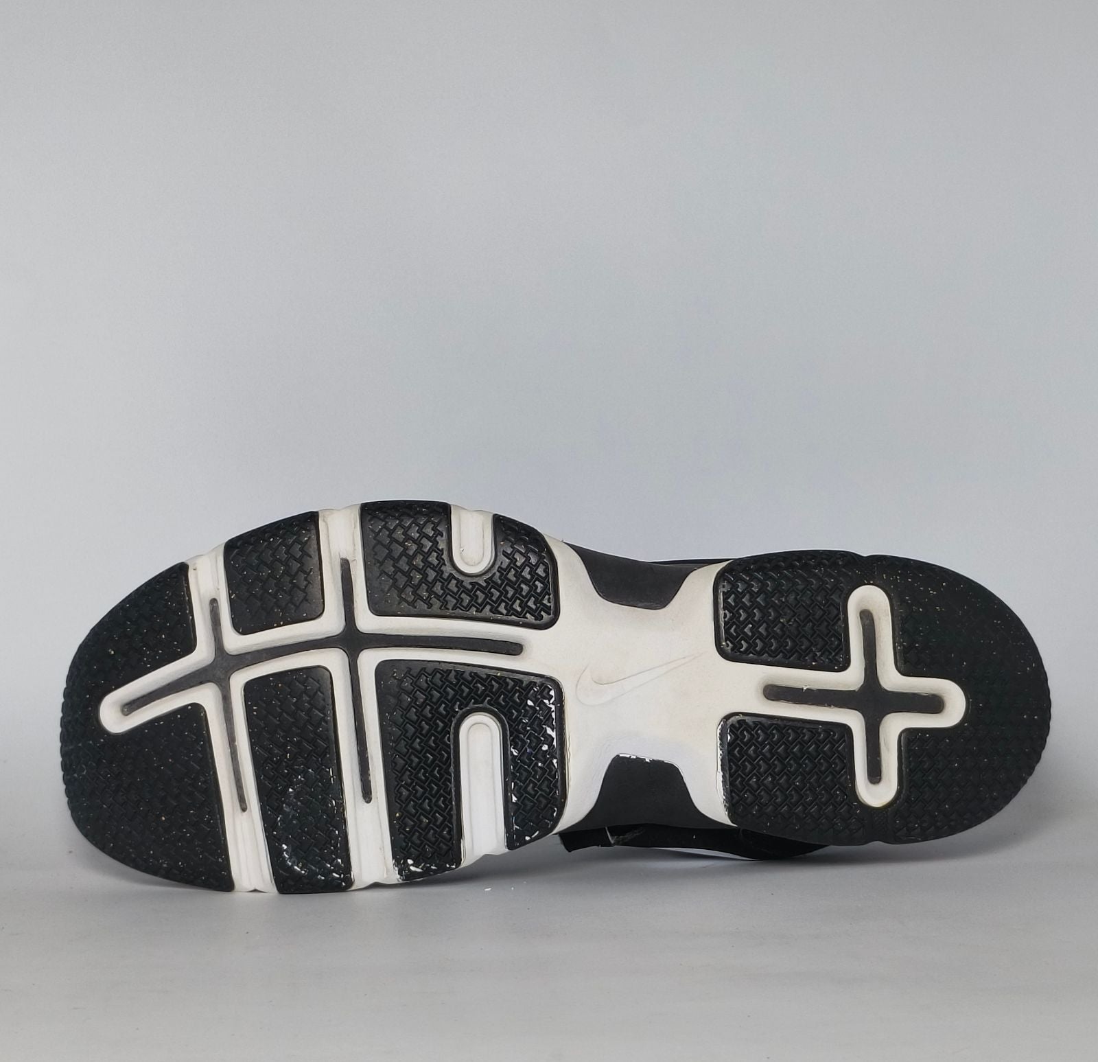 black Nike Lunar Fingertrap TR training shoe featuring a white Swoosh and a white Lunarlon midsole.