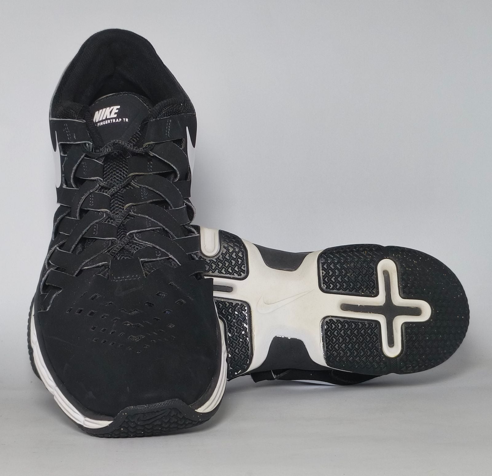 black Nike Lunar Fingertrap TR training shoe featuring a white Swoosh and a white Lunarlon midsole.