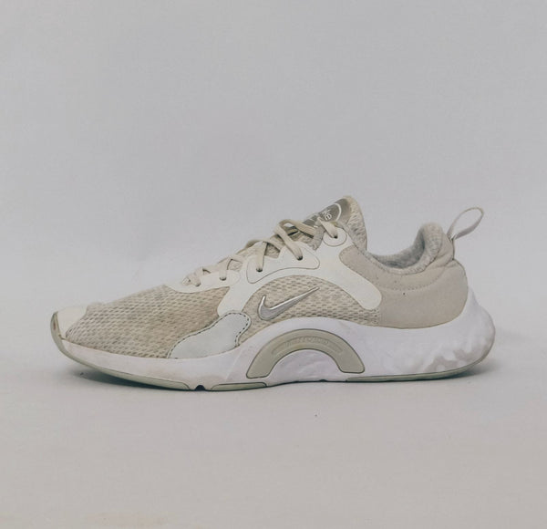 white Nike Renew In-Season TR 10 training shoes featuring a breathable mesh upper and silver Nike Swoosh.