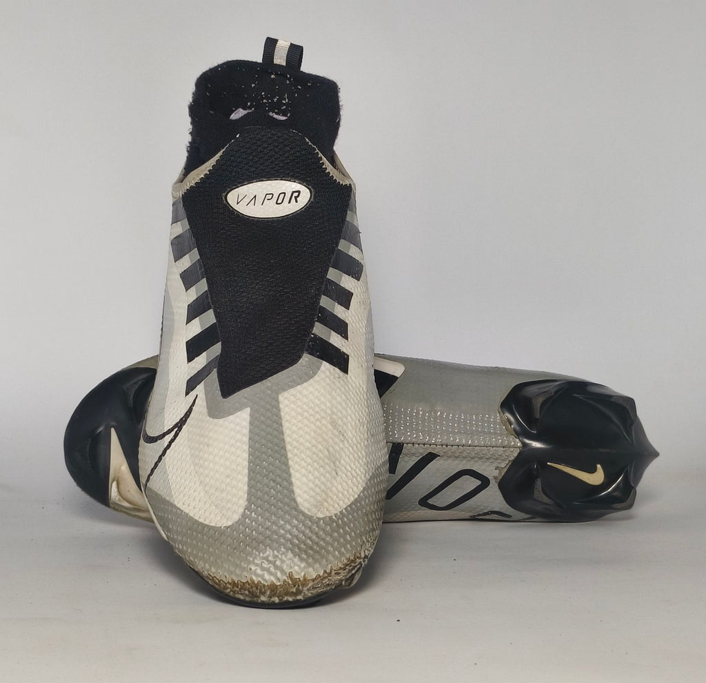 silver and black Nike Mercurial Superfly Academy soccer cleat featuring a Dynamic Fit ankle collar and a specialized multi-ground outsole.