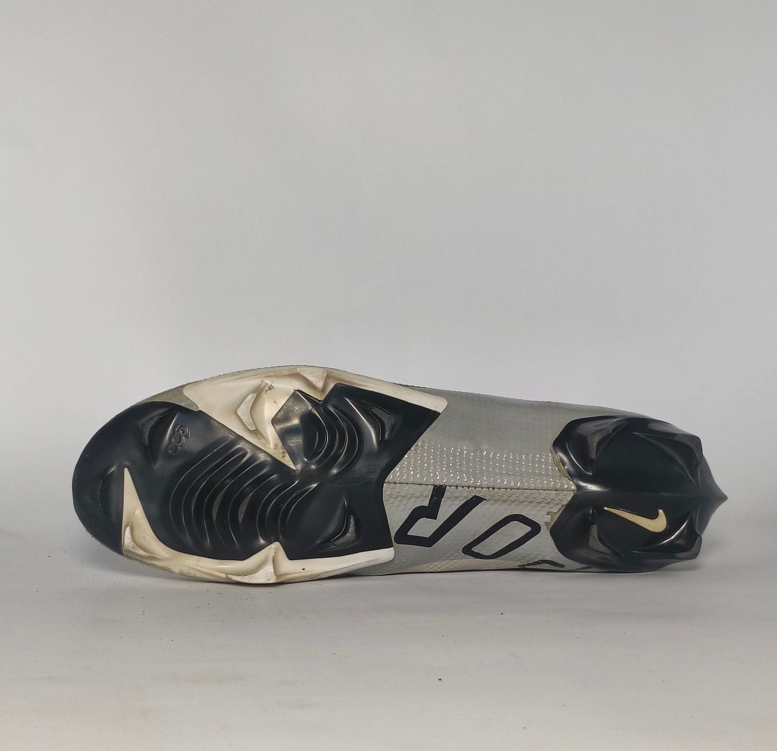 silver and black Nike Mercurial Superfly Academy soccer cleat featuring a Dynamic Fit ankle collar and a specialized multi-ground outsole.