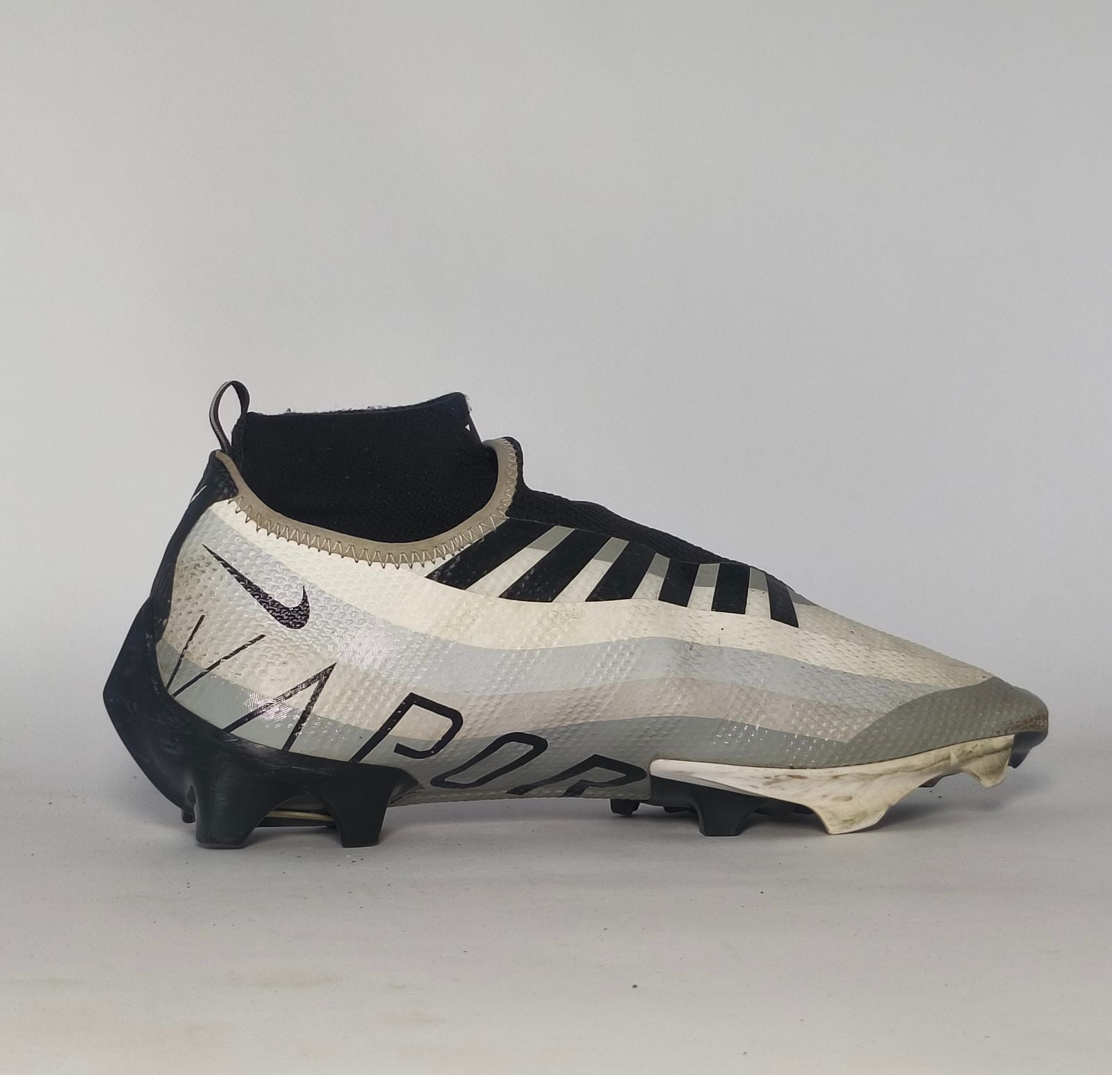 silver and black Nike Mercurial Superfly Academy soccer cleat featuring a Dynamic Fit ankle collar and a specialized multi-ground outsole.