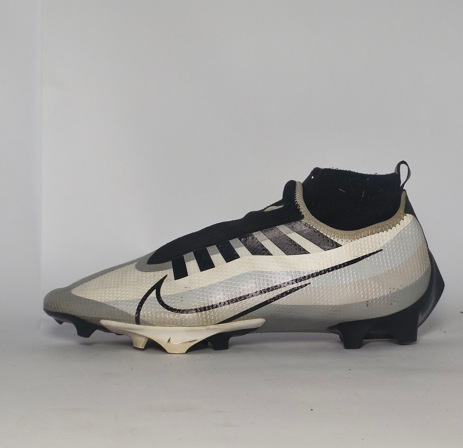 silver and black Nike Mercurial Superfly Academy soccer cleat featuring a Dynamic Fit ankle collar and a specialized multi-ground outsole.