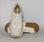 cream and light grey Nike Air Max SC sneaker featuring a visible Max Air unit and a classic gum rubber outsole.