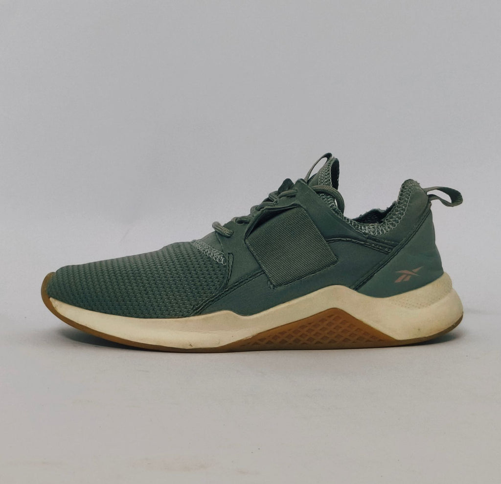 Reebok Nano cross-training shoe featuring a knit upper, cream midsole, and a gum rubber outsole.
