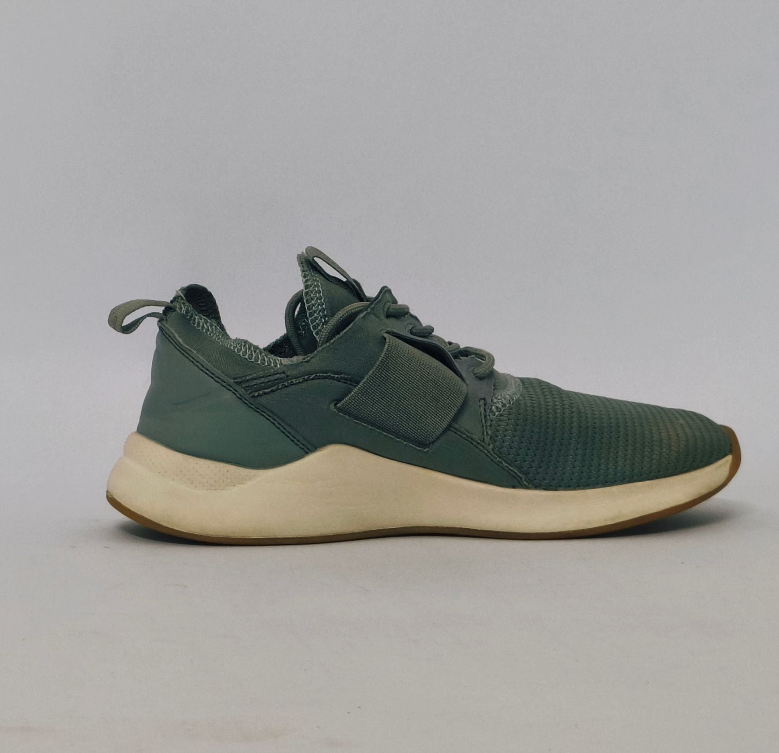 Reebok Nano cross-training shoe featuring a knit upper, cream midsole, and a gum rubber outsole.