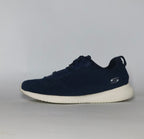 navy blue Skechers BOBS Squad sneaker featuring a white midsole and a textured knit upper.