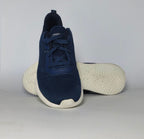 navy blue Skechers BOBS Squad sneaker featuring a white midsole and a textured knit upper.