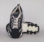 navy blue and silver Skechers D'Lites sneaker featuring a thick white midsole and a rugged black traction outsole.