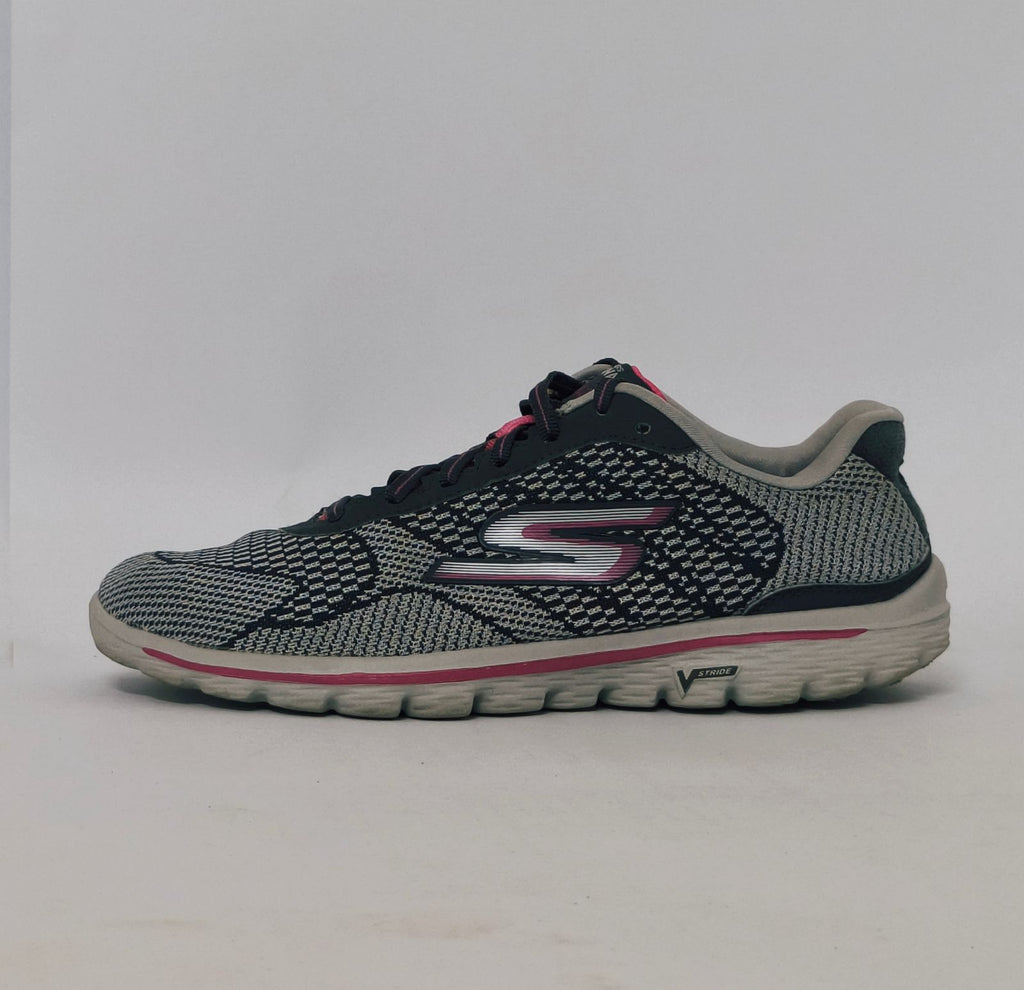 Grey and pink athletic sneakers with breathable knit upper and cushioned sole in used condition size US 8