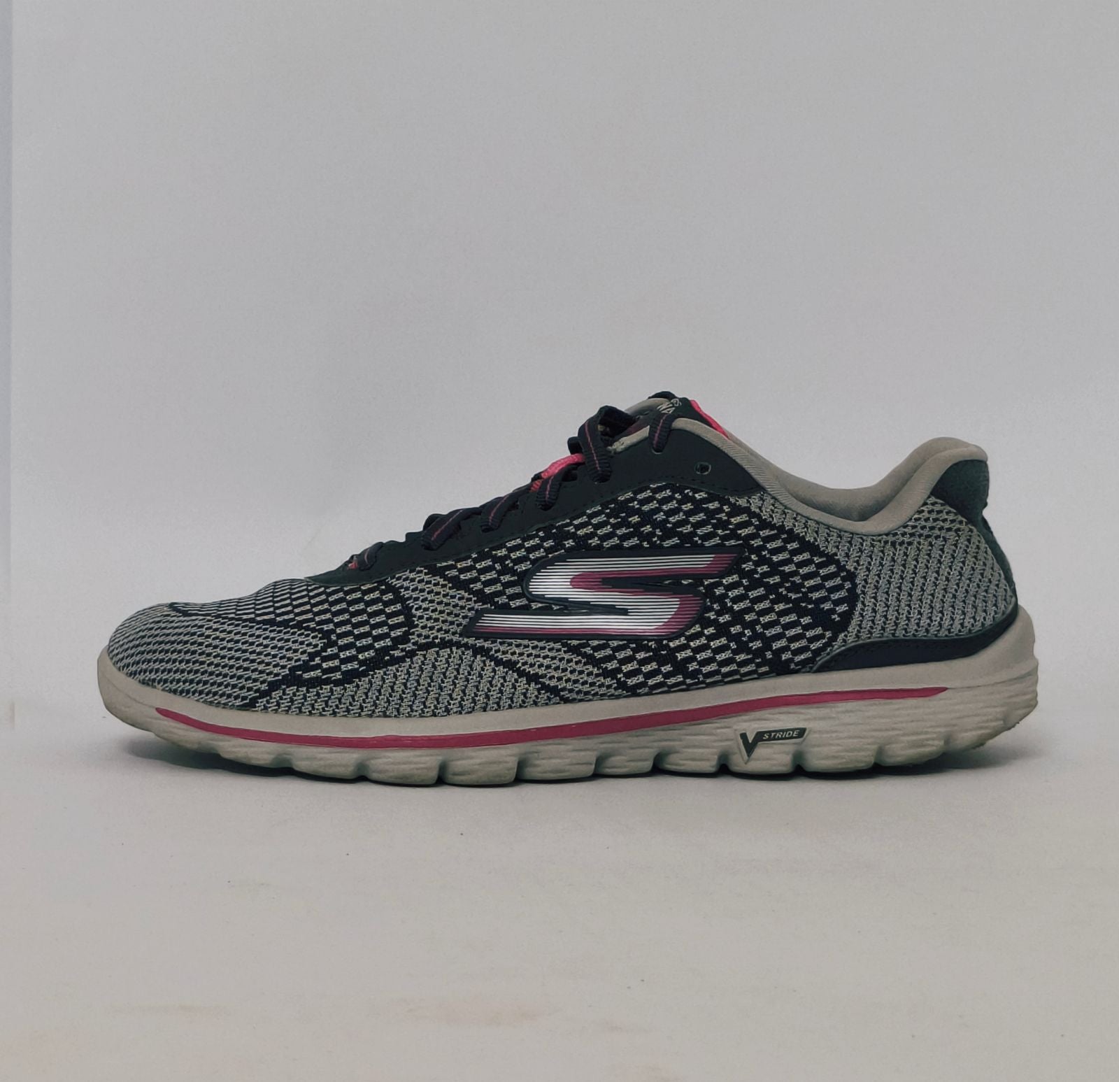 Grey and pink athletic sneakers with breathable knit upper and cushioned sole in used condition size US 8