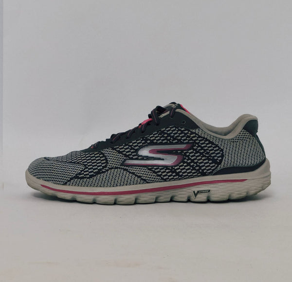Grey and pink athletic sneakers with breathable knit upper and cushioned sole in used condition size US 8