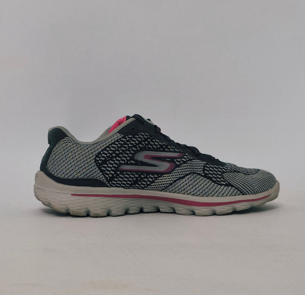 Grey and pink athletic sneakers with breathable knit upper and cushioned sole in used condition size US 8