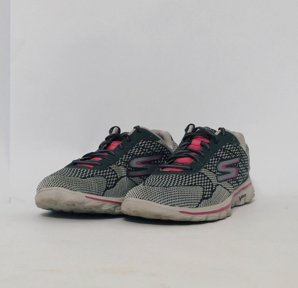 Grey and pink athletic sneakers with breathable knit upper and cushioned sole in used condition size US 8